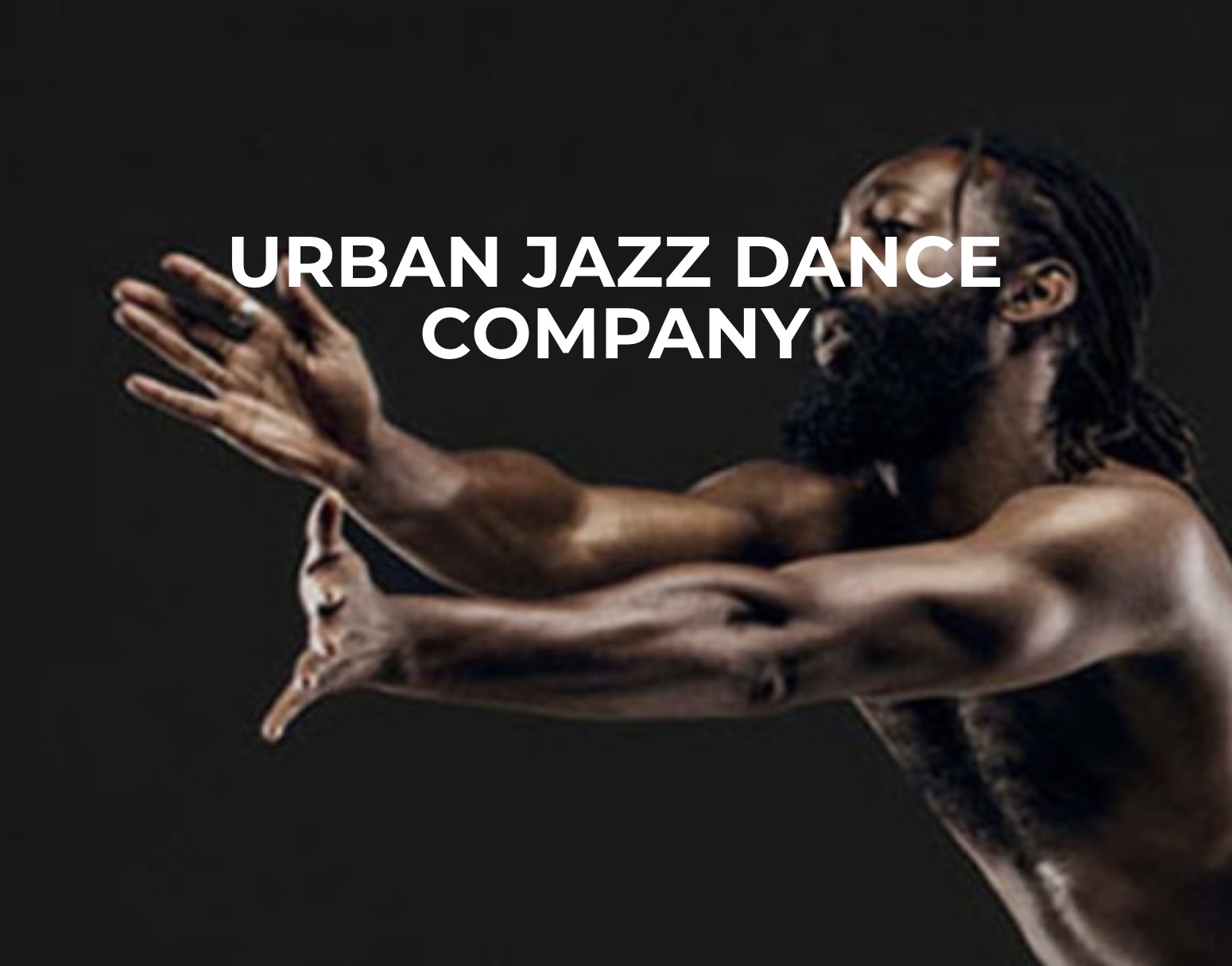 Logo of Urban Jazz Dance Company Access Services with photo of shirtless male dancer in the background.
